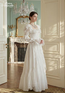 Ivory long-sleeve tiered lace dress with ruffle neckline and layered skirt