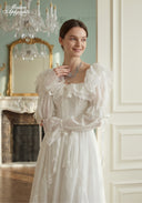 Ivory tiered lace dress with lace puff sleeves and lace-trim bodice