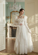 Ivory tiered lace dress with lace-trim puff sleeves and gathered bodice