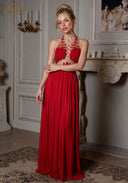 Star of Crystal Gown in red, front view with gold beaded halter and flowing pleated maxi skirt