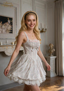 Light blue patterned ballet dress with gathered bodice, bow waist tie, tiered skirt, lace trim