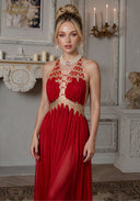 Red halter gown with beaded neckline and tassel fringe bodice, long pleated skirt