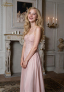 Blush pink sleeveless lace gown with sweetheart neckline and soft pleated skirt