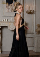 Black halter gown with tasseled shoulder detail and open-back design