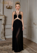 Black halter gown with beaded neckline and draped pleated skirt