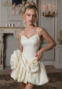 Ivory midi dress with spaghetti straps, fitted bodice, and rose-appliqué bubble skirt