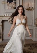 Star of Crystal Gown in white, halter neckline with gold beadwork and tiered maxi skirt