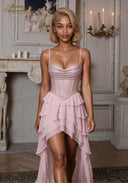 Pink sequin camisole mini dress with spaghetti straps and tiered ruffle skirt