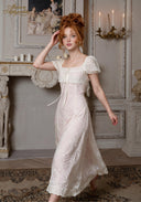 Chérie ivory tulle dress with lace trim, puff sleeves, and front ribbon tie