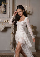 White lace dress with square neckline, sheer long sleeves, ruched bodice, thigh slit.