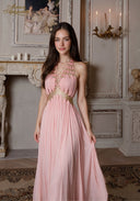 Pink halter gown with beaded bodice and pleated flowing skirt