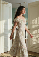 Cream floral off-shoulder dress with ruffled sleeves, lace hem and pink ribbon detail