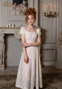 Tulle dress with puff sleeves, square neckline, and front tie in pale pink