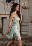 V-neck sleeveless babydoll dress with beaded waist detail, mint green pleated skirt