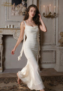 Ruched satin slip dress with spaghetti straps and cowl neckline, long layered hem