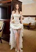 White lace off-shoulder corset set with layered ruffled skirt and sheer stockings
