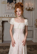 Chérie tulle dress with square neckline, short puff sleeves, and front tie detail