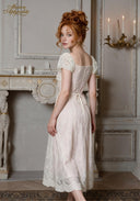 Chérie tulle dress with square neckline, short sleeves, lace trim, and tie back
