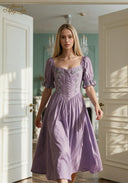 Lilac puff-sleeve midi dress with square neckline, corset-style seams, and gathered skirt