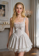 Light blue ballet dress with square neckline, pink ruffle trim, gathered waist bow, lace bottom