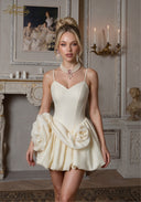 Cream spaghetti-strap dress with fitted bodice and rosette skirt