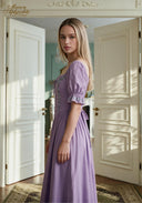 Lilac puff-sleeve midi dress, side view with tied waist and gathered skirt