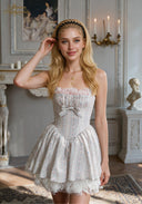 Light blue dress with spaghetti straps, gathered bodice and bow waist, tiered skirt, lace trim