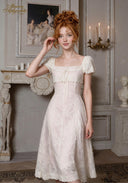 Chérie tulle dress with square neckline, short puff sleeves, and lace hem