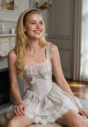 Light blue short ballet dress with ruched bodice, bow tie detail, layered skirt, lace trim