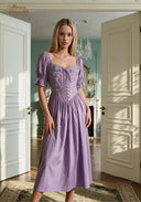 Lilac puff-sleeve midi dress with square neckline, lace-up bodice, and tied waist
