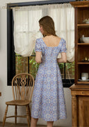 Light blue floral midi dress with puff sleeves, lace-trim square neckline, back view