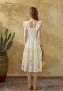 White lace embroidered dress, open back with square yoke and cap sleeves, tiered midi skirt