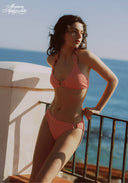 Bikini set in coral red striped knit with triangle top and tie hip bottoms