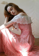 Off-shoulder gingham plaid maxi dress with white lace neckline and red ribbon bow