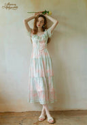 Pastel floral tiered midi dress with puff sleeves and scalloped lace trim