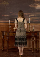 Black mesh lace dress from the back with V-neck style and scalloped tiered skirt