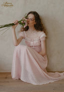 Light pink dotted midi dress with ruffled cap sleeves and softly gathered skirt