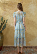 Light blue floral midi dress, back view, tiered skirt and gathered waist