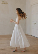 White sleeveless fit-and-flare dress with lace trim and full skirt
