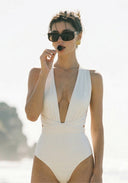 Ivory one-piece swimsuit with halter straps and deep V front