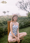 Blue-and-white striped one-piece swimsuit with thin straps and sporty cut
