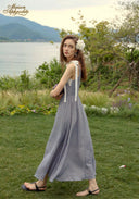 Blue patterned midi dress with lace square neckline, ribbon ties, and thin straps