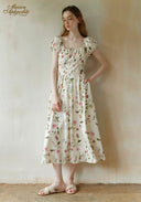 Floral dress with round neckline, short puff sleeves, and midi gathered skirt, white