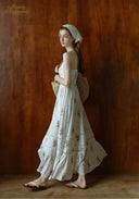 Floral tiered maxi sundress with thin straps and gathered waist, sleeveless