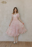 Rose pink tiered flared midi dress with lace collar and short puff sleeves, front view