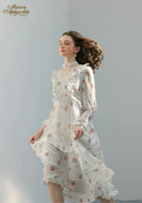 Floral midi dress with ruffled detail along the bodice and long sleeves