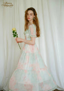 Pastel floral dress with puff sleeves, lace trim, and tiered A-line skirt