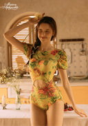Yellow floral-print one-piece swimsuit with puff sleeves and ruched neckline