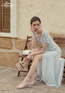 Blue Celeste floral dress with V-neck and gathered waist, side slit, holding parcel