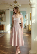Pink lace midi dress with square neckline, cap sleeves, fitted bodice, flared skirt at hem